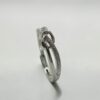 Destined Knot Silver Ring |命運交織綁結白銀戒正中央的繩結工藝與磨砂紋理細節特寫 - Ostialia 奧斯提亞